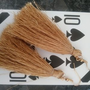 Gold colored tassel dangle earrings